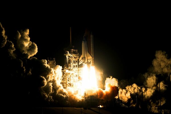 The space shuttle takes off beautifully at night