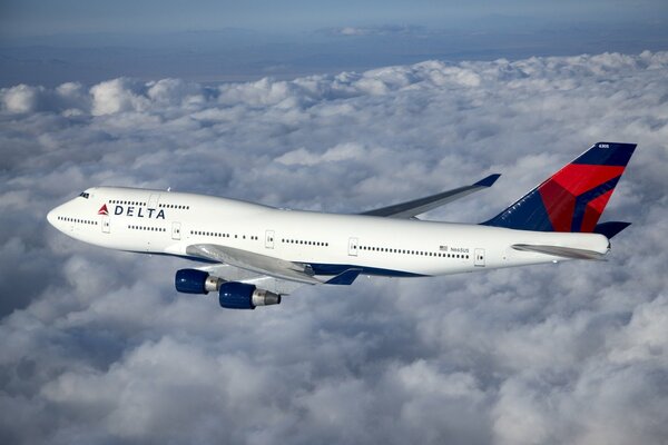 The flight of a passenger Boeing in the clouds