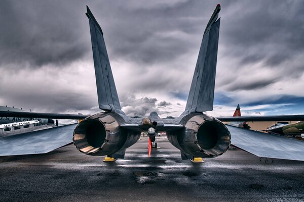 Large fighter jet rear view of turbines and wings in the open air