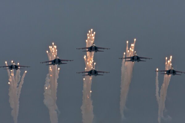 Aviation volleys from planes in the night sky