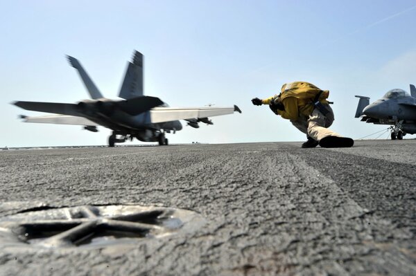 Take-off of a hornet from the deck of an aircraft carrier