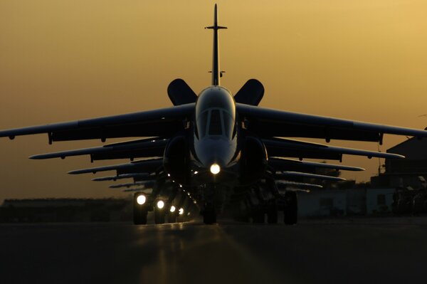 Planes in a row at evening sunset