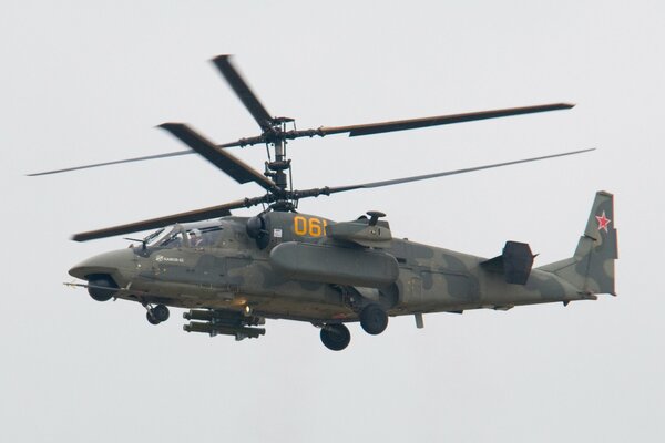 KA-52 combat helicopter in flight on military duty