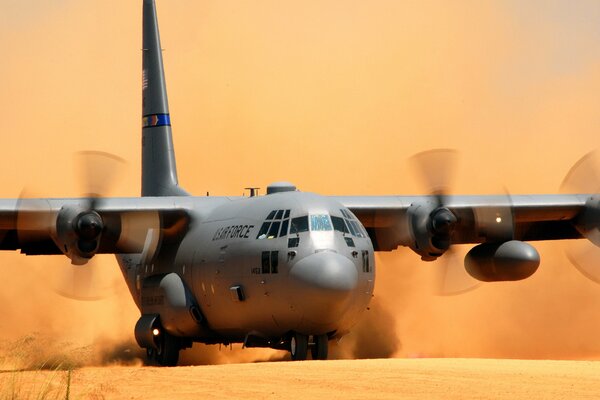 A giant plane is landing in the desert