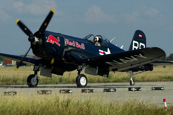 Dark blue fighter jet on the runway