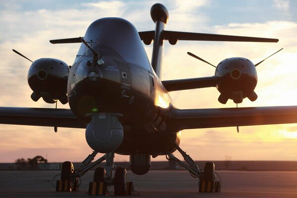 A copy of a large aircraft on the background of sunset