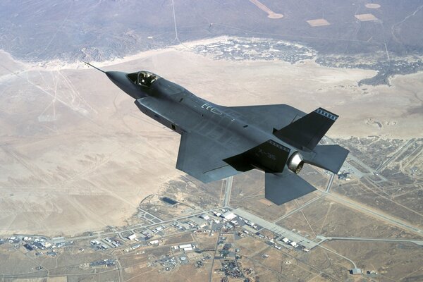 F-35 fighter jet high above the ground