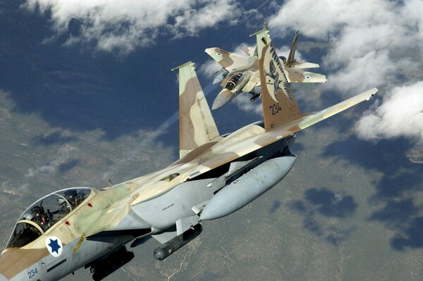 F 15 military fighters with camouflage in the open sky