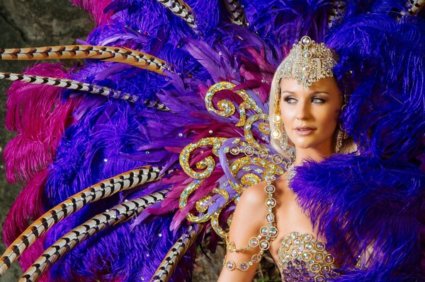 A girl in a feather dress at the carnival