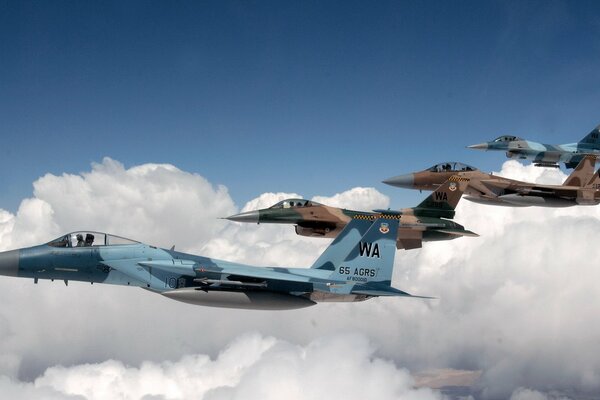 Formation of planes over white clouds