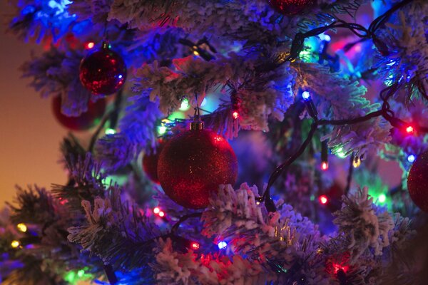 Christmas tree toys and garland on the branches