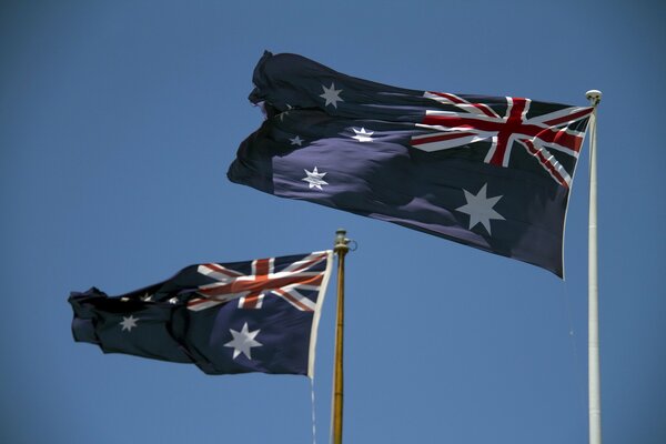 The flags are fluttering in the wind. Australia