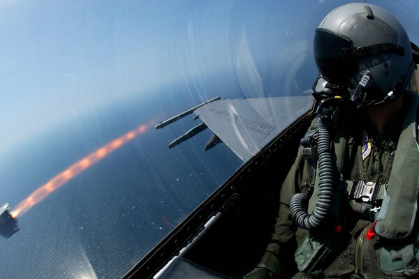 The fighter pilot watches the projectile