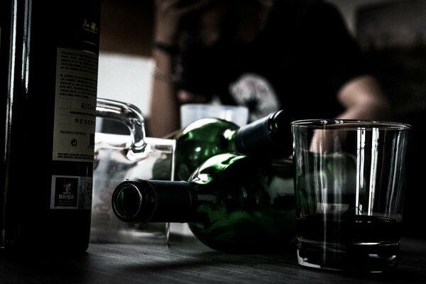 Empty bottles and glasses on the table