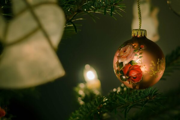 Christmas ball on the background of a burning garland