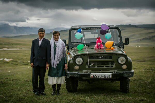 A couple of newlyweds on a wedding UAZ