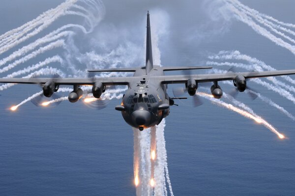 Lockheed-130H ac spectre aircraft over the sea