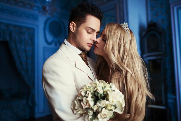 Tender embrace of the bride and groom