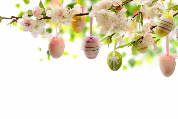 Easter eggs on a tree among flowers