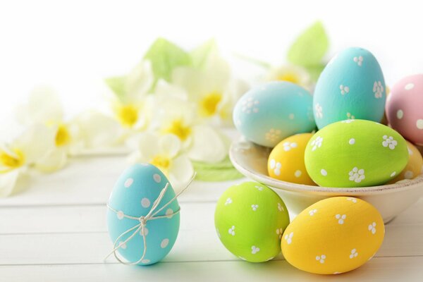 Easter spring background with colorful eggs and flowers