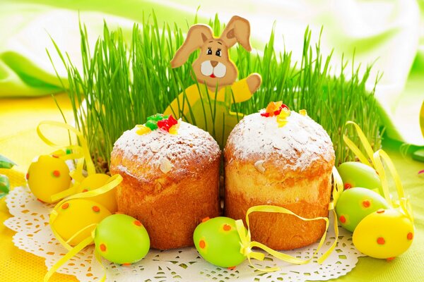 Easter cakes with eggs on the grass