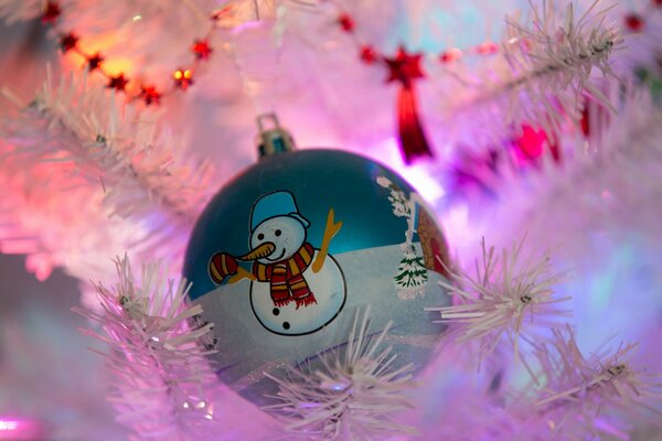 Christmas tree toy on a white Christmas tree with lighting