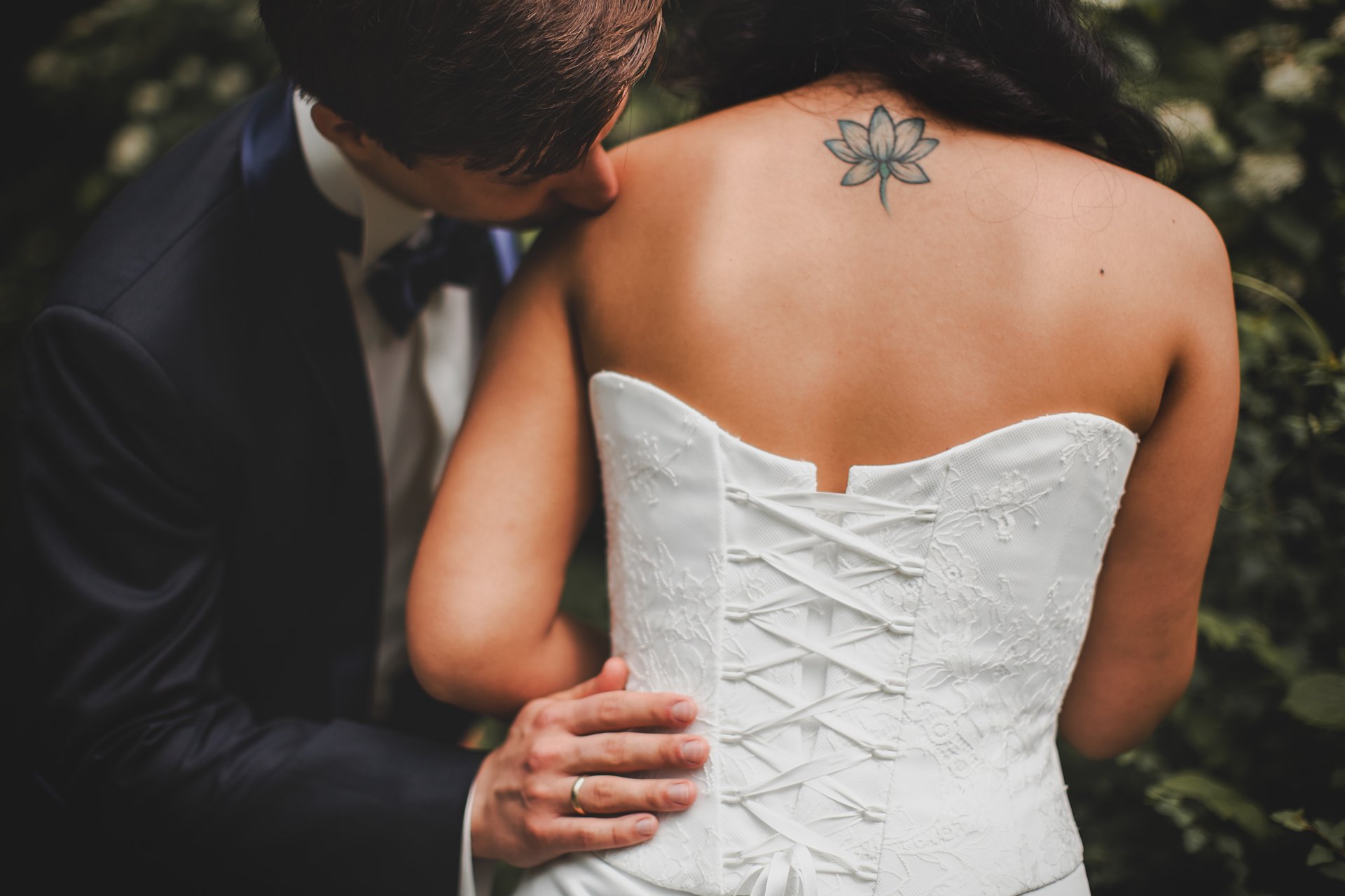 groom bride kiss tattoos spin dress corset ring