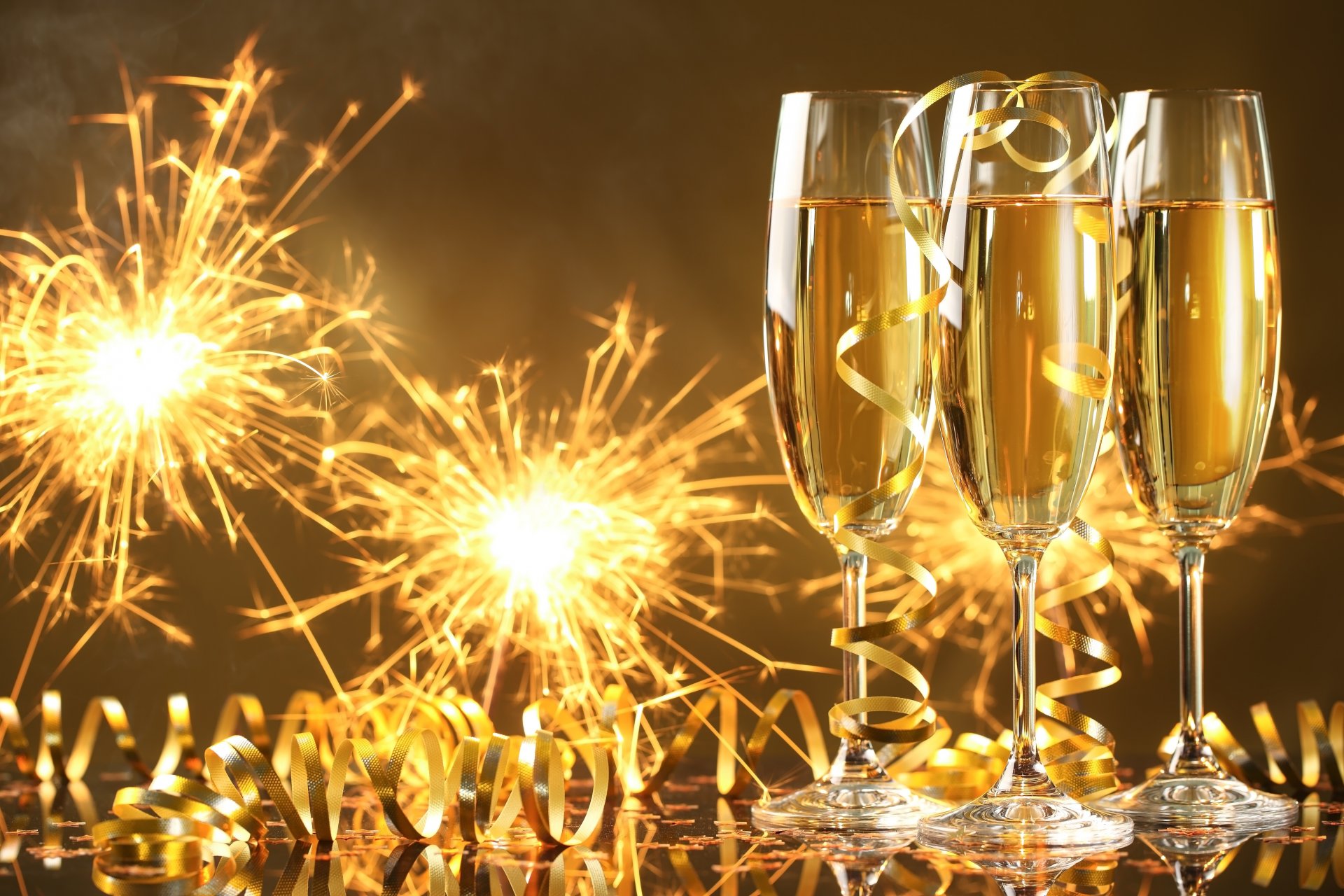 happy new year champagne golden celebration holiday glasses serpentine sparkler