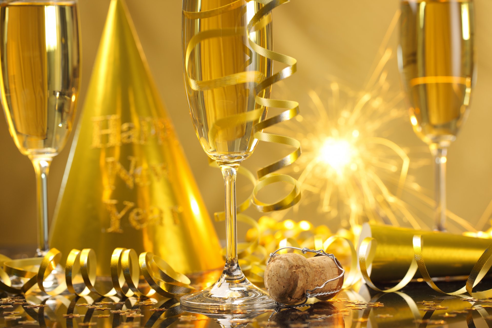 happy new year champagne golden celebration holiday glasses serpentine sparkler