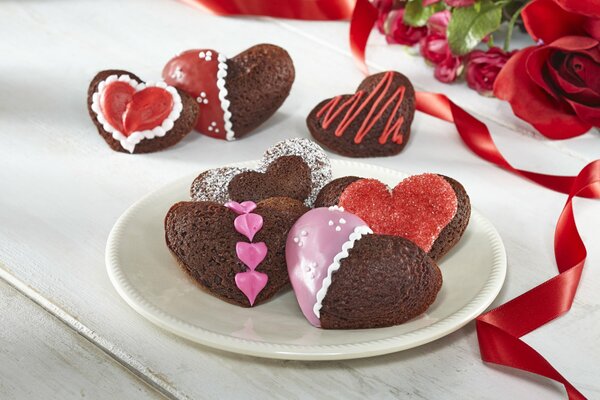 Cookies in the shape of hearts with colored glaze
