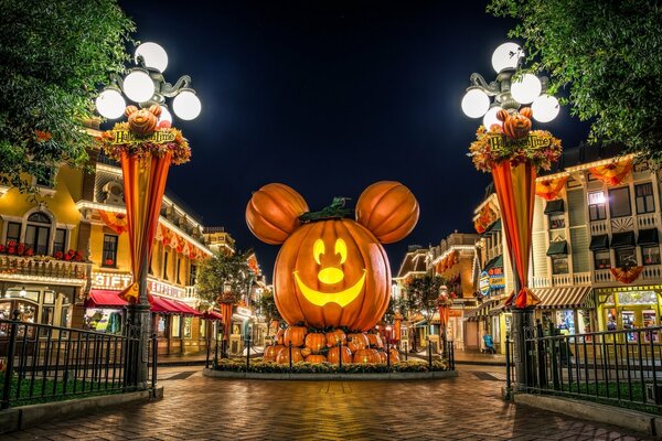 A huge pumpkin in the shape of Mickey Mouse on the square in Disneyland