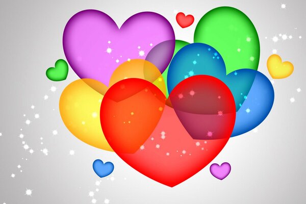 Corazones multicolores transparentes sobre fondo gris