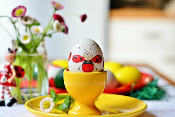 A painted ladybug on an egg