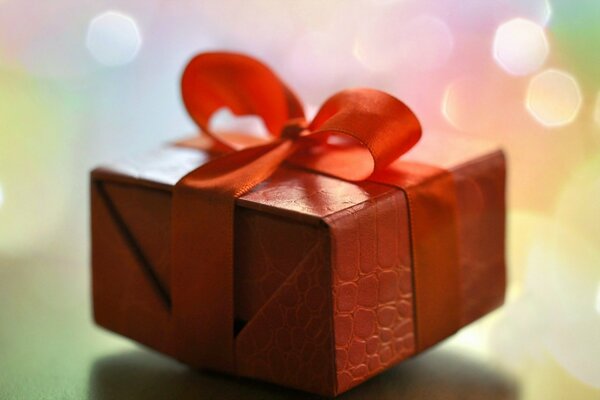 Box with red ribbon