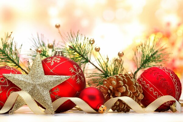 Christmas balls, a star, a cone and pine branches