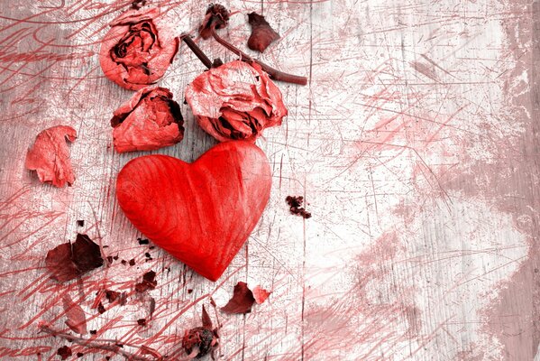 A tiny heart in rose petals
