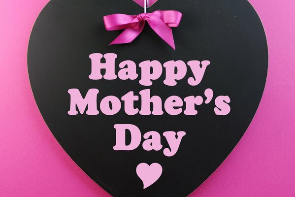 Beautiful black heart on pink background