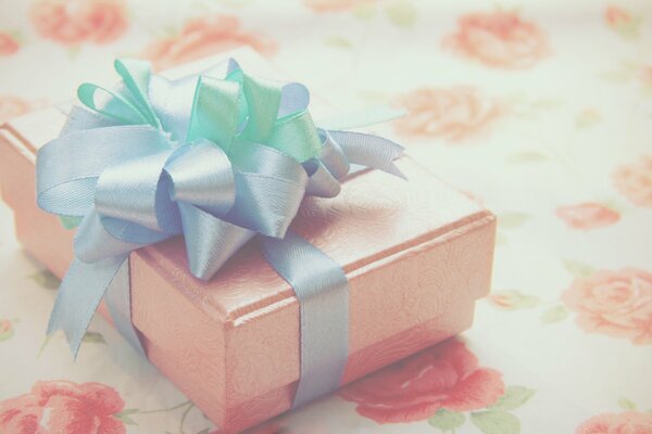 Gift box with a blue bow