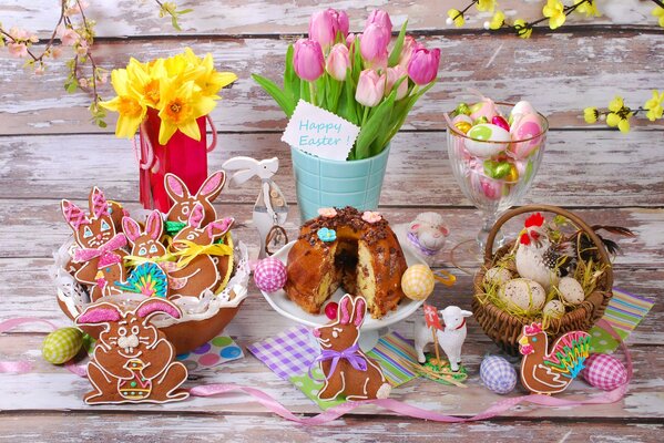 Easter eggs with cakes and flowers