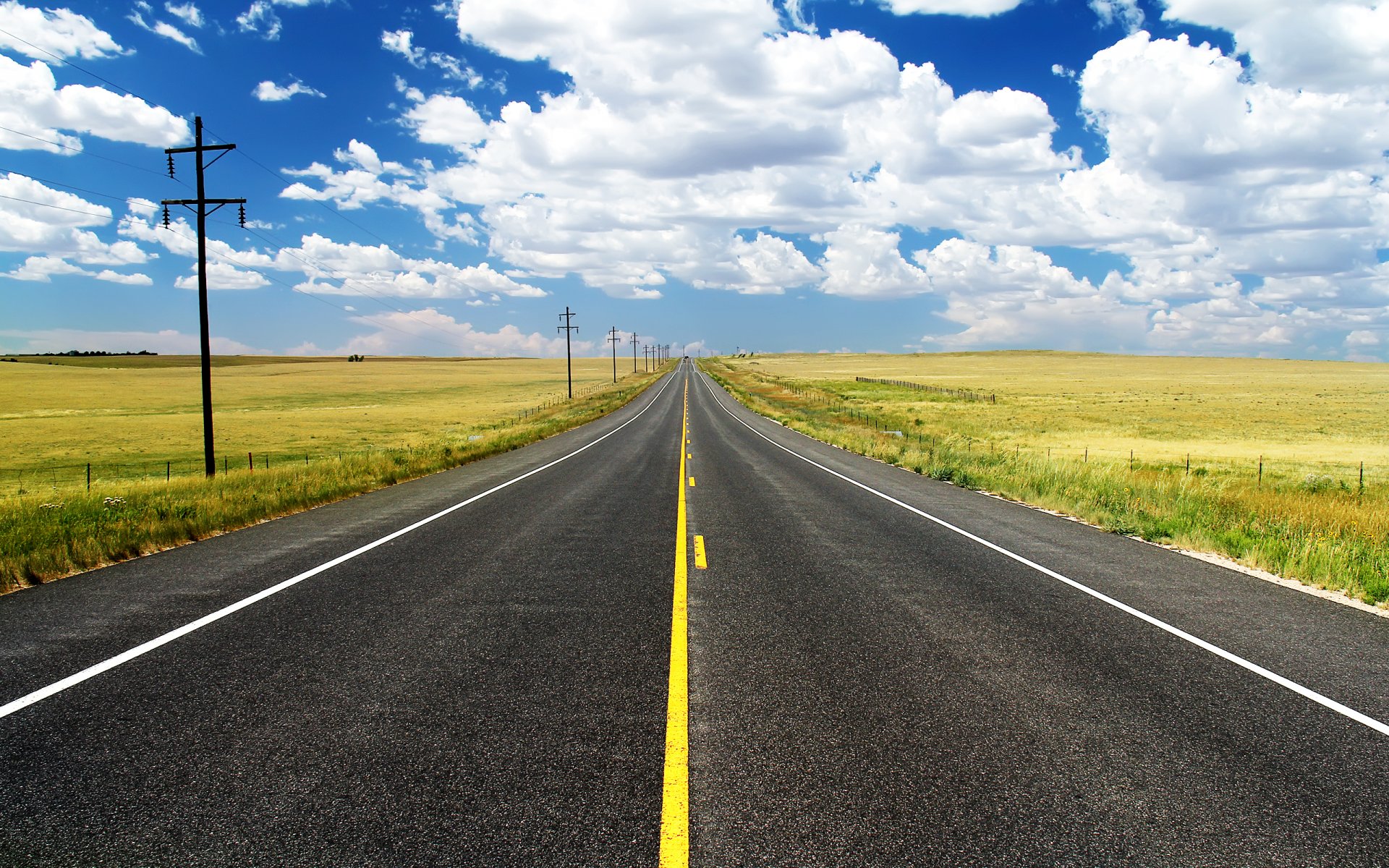 road counting lap of the field grass clouds sky