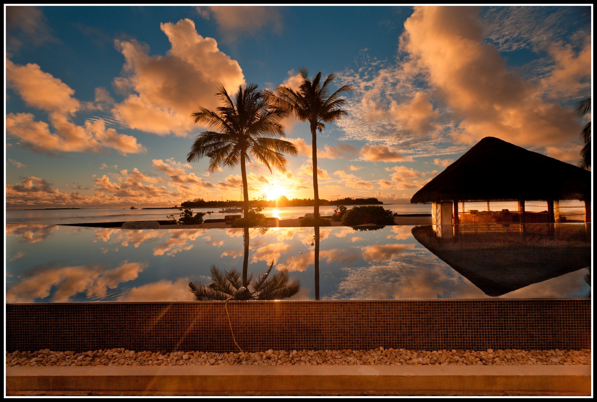 unset water palm sky clouds sun the maldive