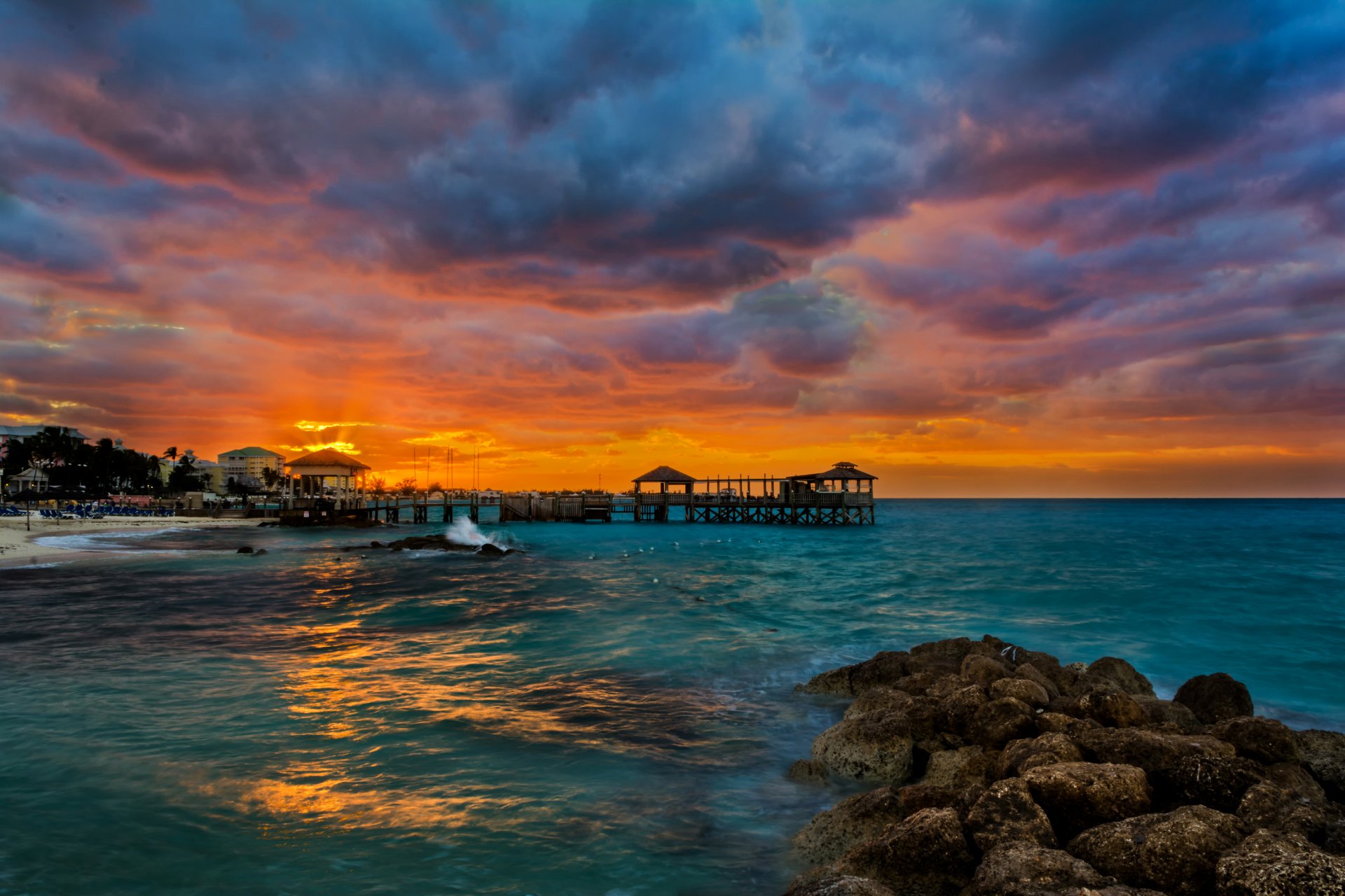 trópicos playa mar piedras muelle amanecer nassau bahamas