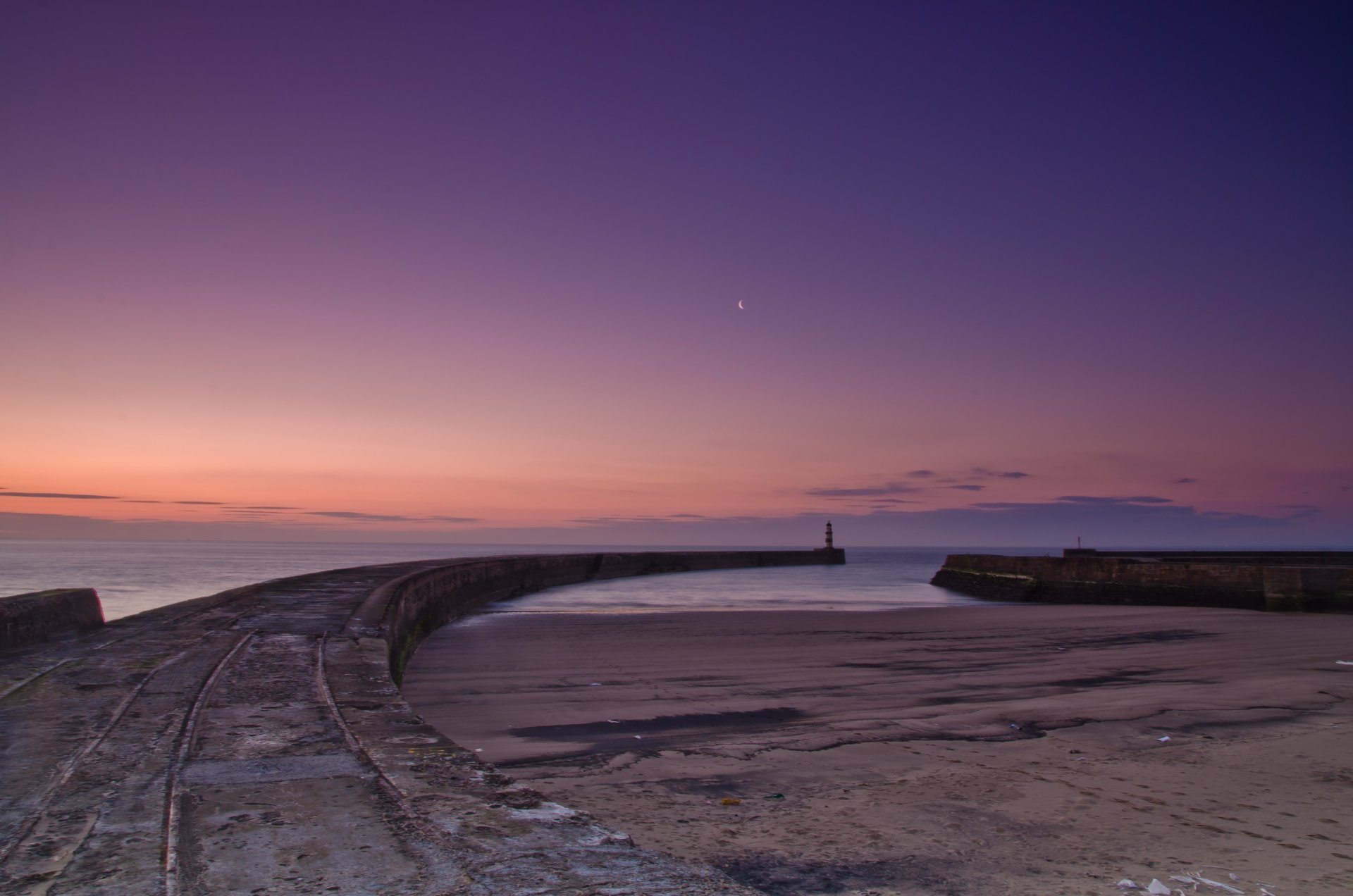 lighthouse ocean water sky year sand