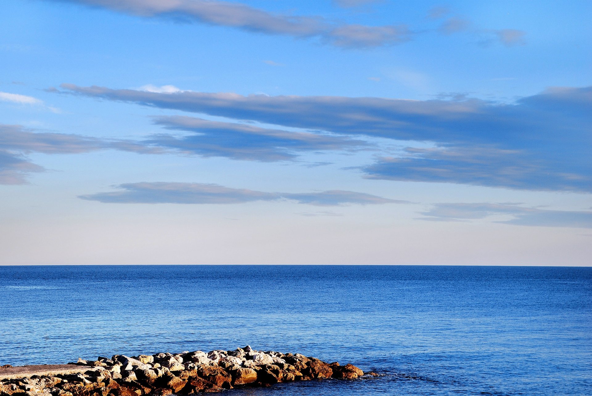 ea beach spit stones horizon sky