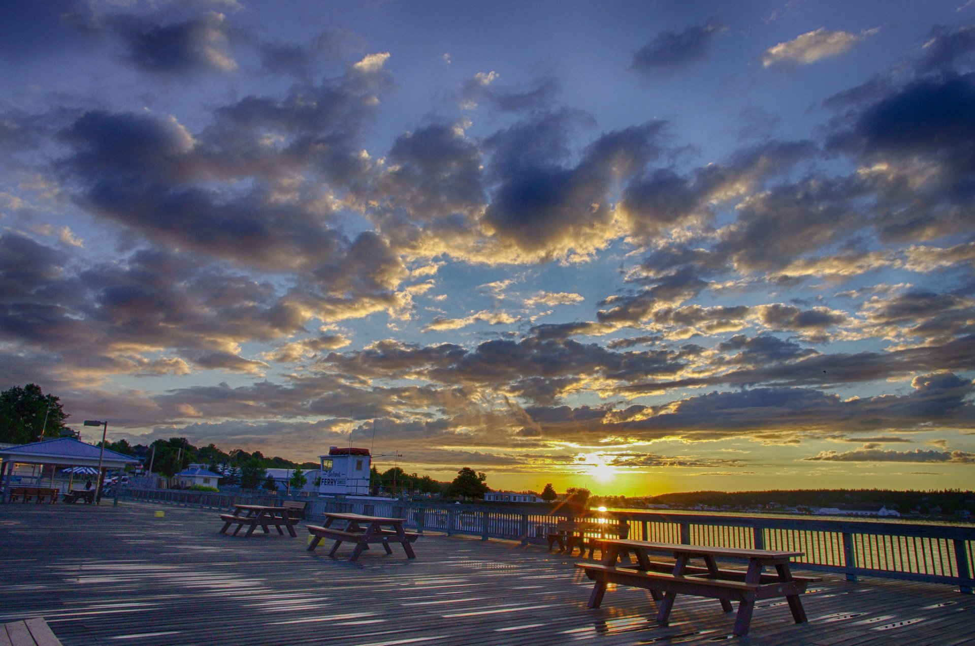 river embankment sun clouds morning