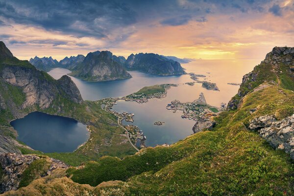 The sea surrounded by mountains in the evening