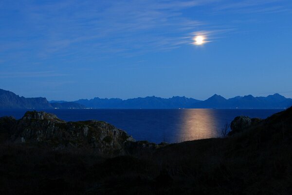 Night sky moon among the mountains