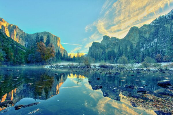 The mountain landscape is beautifully reflected in the lake