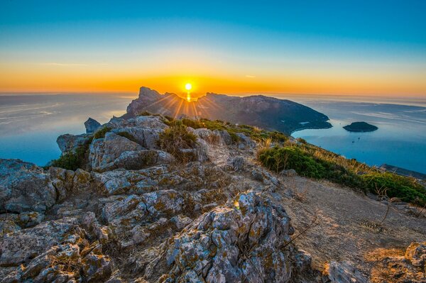 Meer Sonnenuntergang Sonne Felsbrocken spanische Stiefel