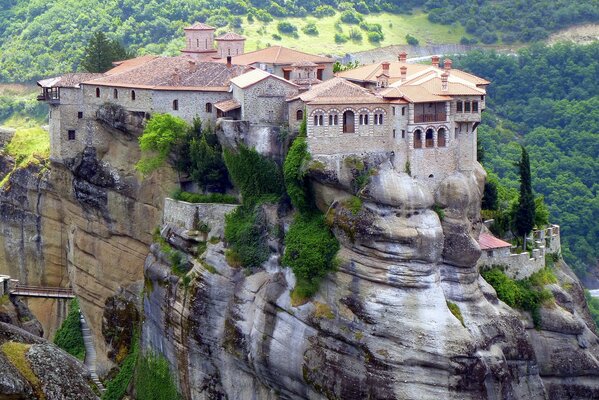 Monastery of light stone on the rocks in Greece